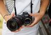 Person holding Canon EOS R with Drop-in Filter Mount Adapter EF-EOS R and lens