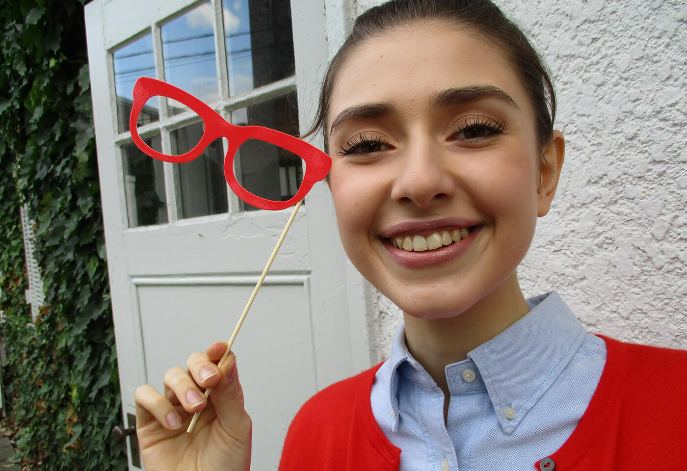 Image of girl holding glasses