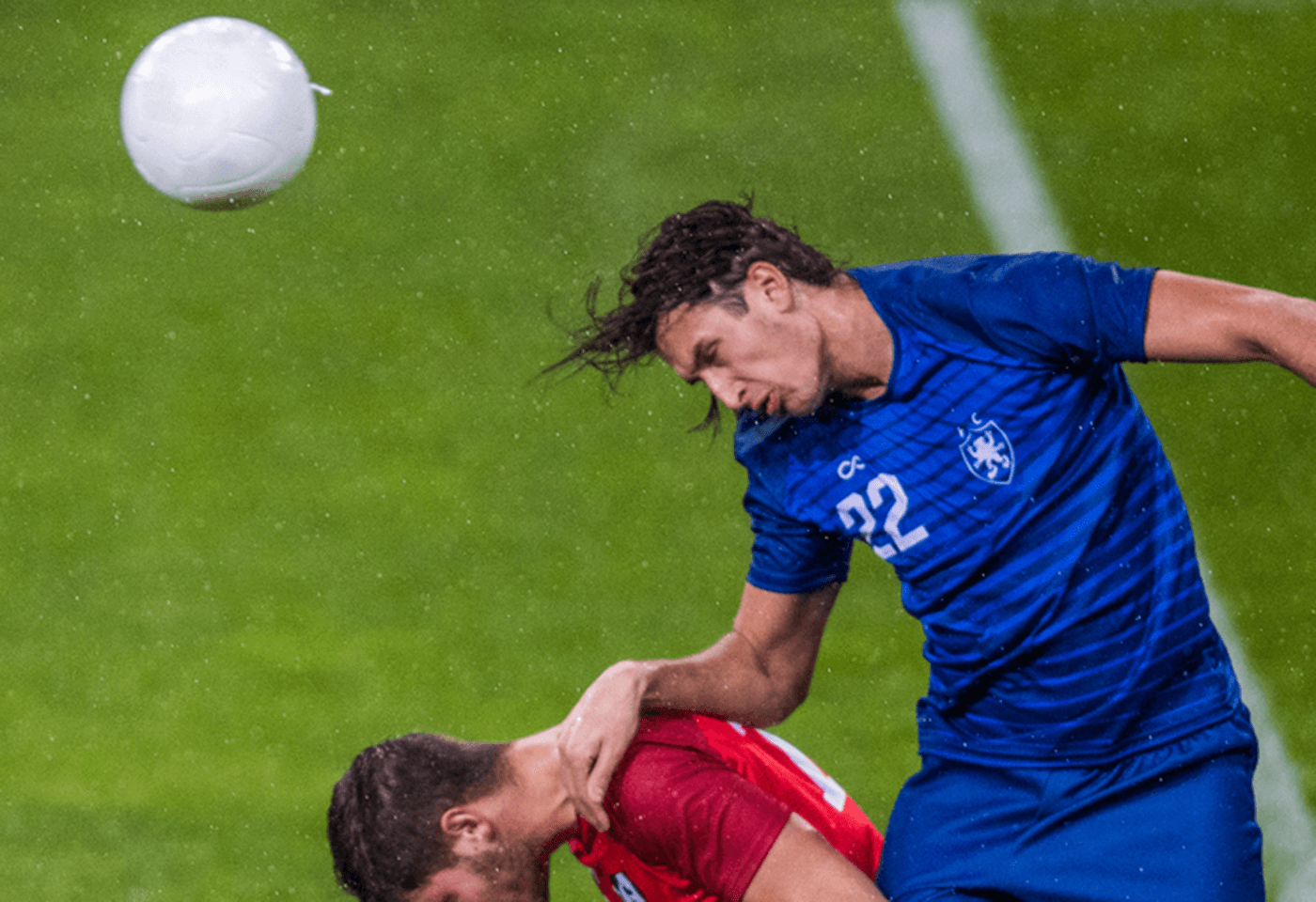 Football players in action taken using the UHD DIGISUPER 122 AF broadcast lens