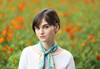 Portrait image of a model in a flower field taken using the RF 135mm f/1.8L IS USM prime lens