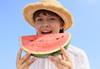 Child eating watermelon shot using RF 50mm f/1.8 STM prime lens