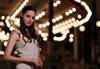 Model in front of carousel taken using RF 85mm f/1.2L USM DS prime lens