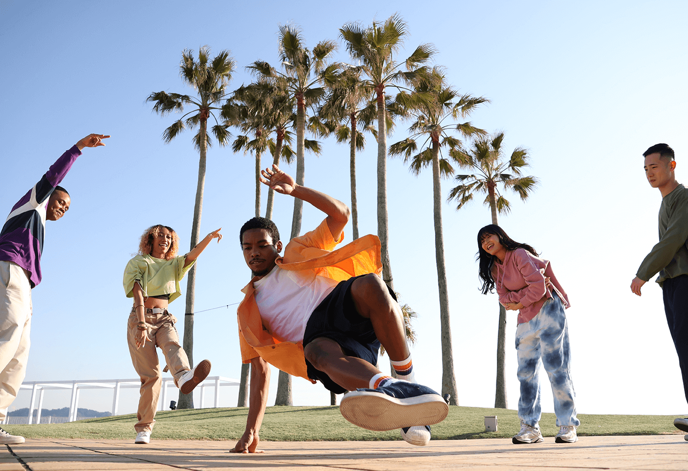 Image of a group of friends dancing taken using RF-S 18-150mm f/3.5-6.3 IS STM standard zoom lens