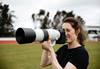 Photographer using the Canon RF 200-800mm f/6.3-9 IS USM telephoto lens with hood