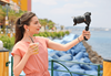 Image of a vlogger recording while holding a drink taken using the RF 15-30mm f/4.5-6.3 IS STM wide angle lens