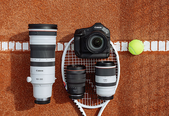 Flatlay image of Canon gear on a tennis court