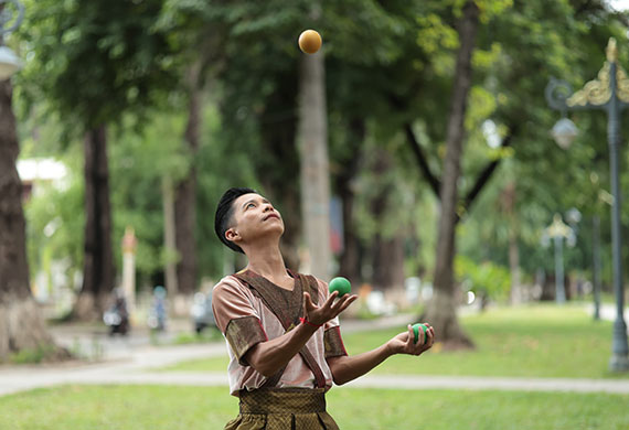Image of a person juggling in the park