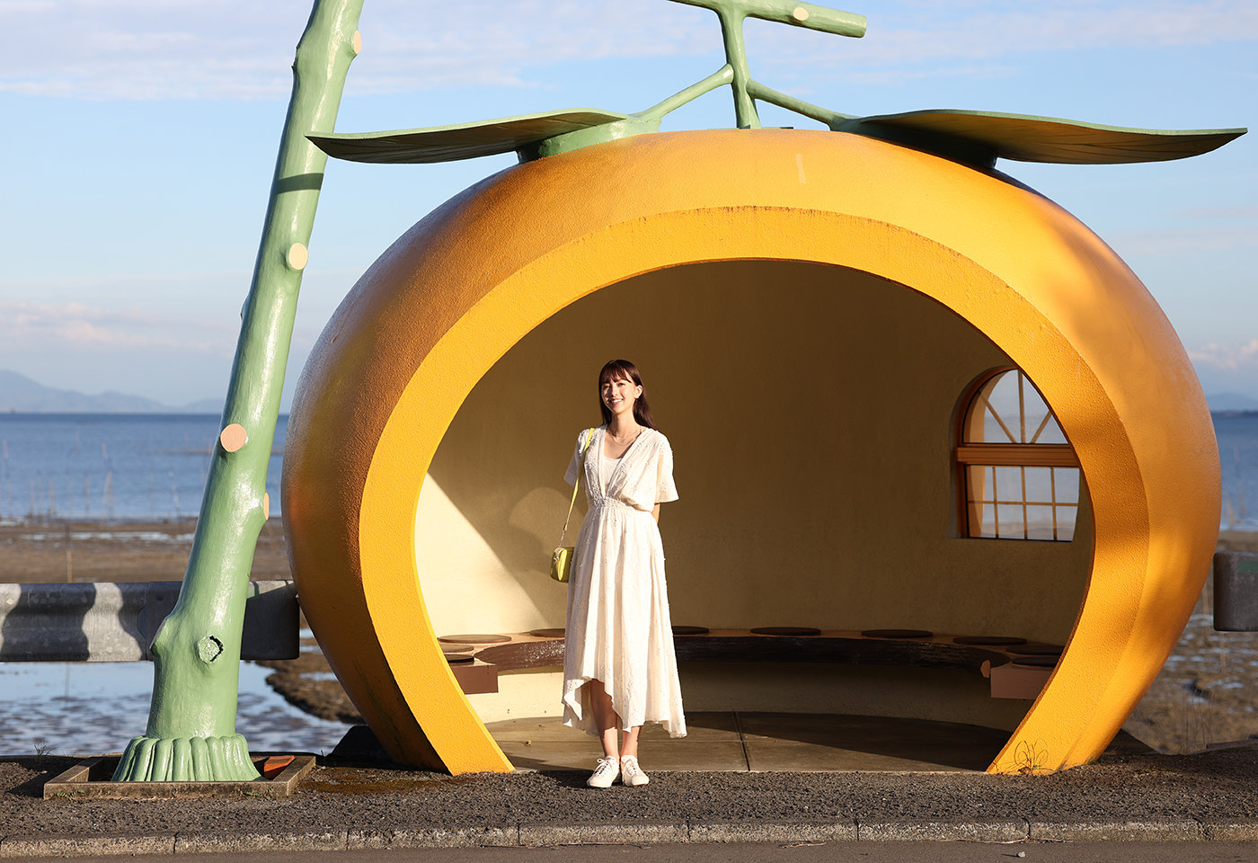 Model posing inside the melon house taken using the EOS R8 mirrorless camera