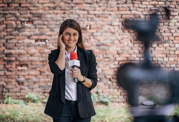 Image a woman reporting live captured by Canon broadcast gear