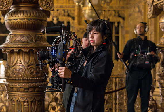 Woman filming using Canon gear