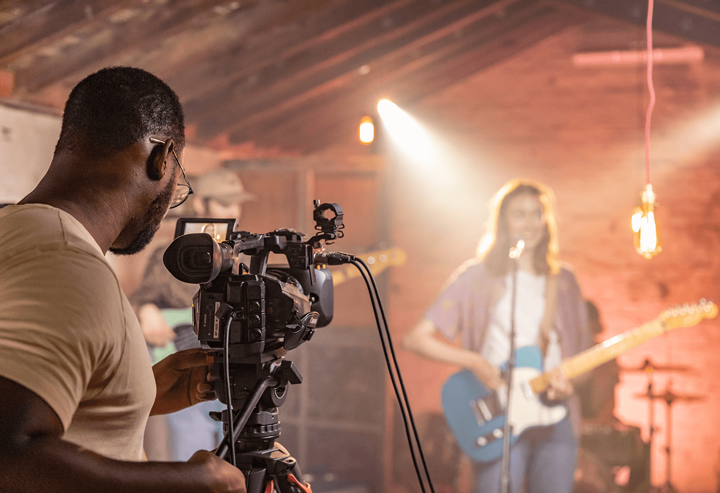 Band member singing and playing guitar