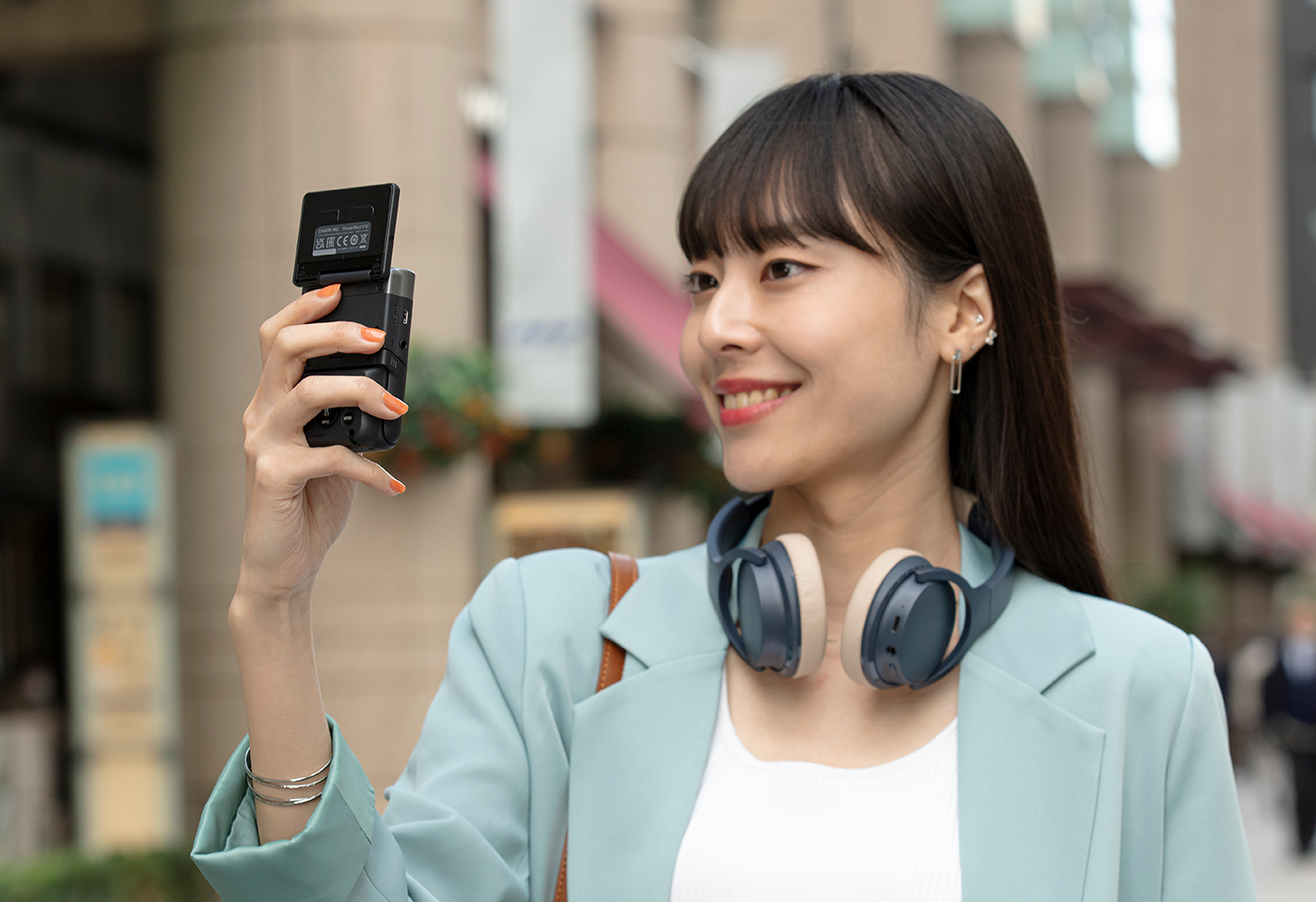 Image of the PowerShot V10 camera in use