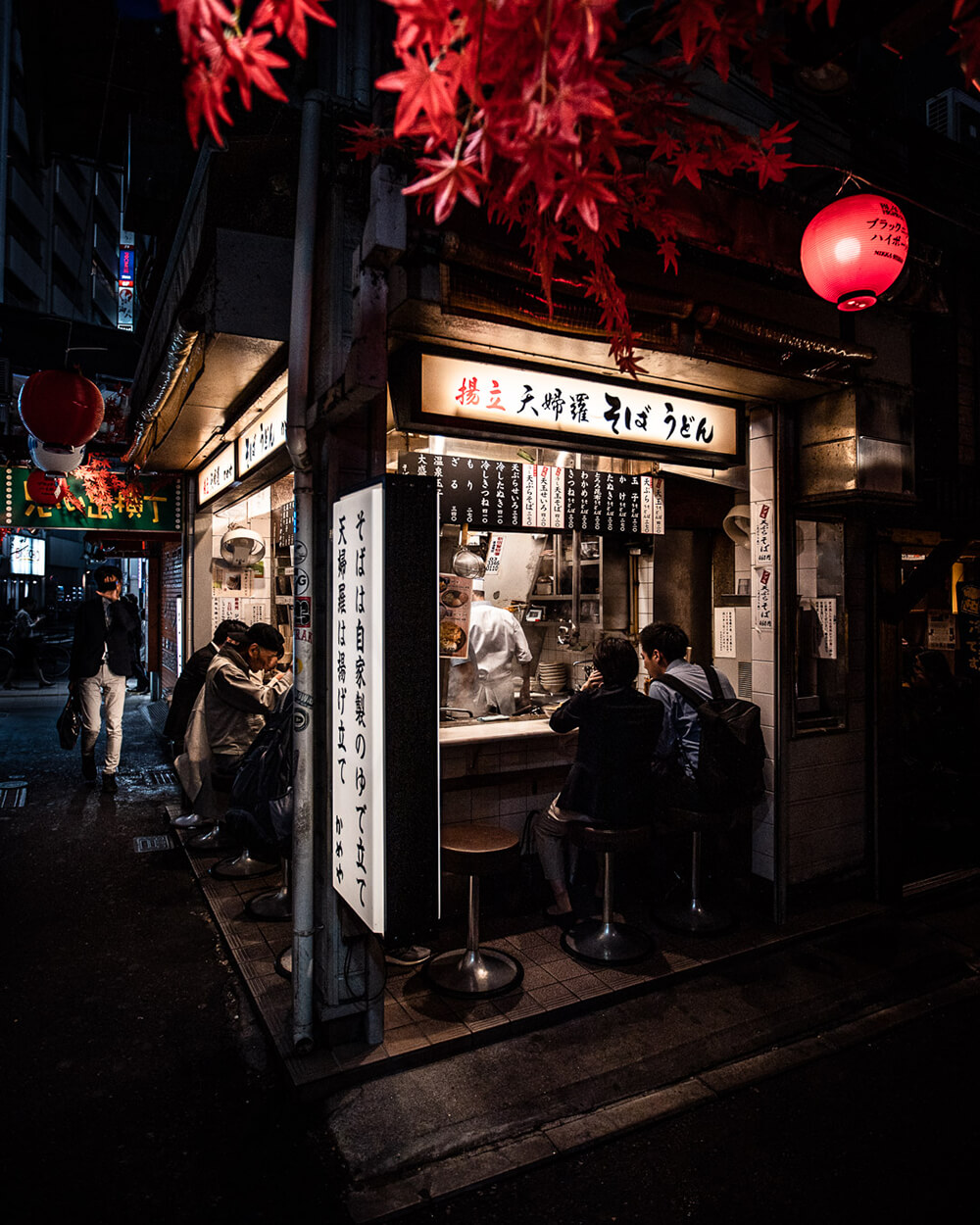 Low light image of night store with higher exposure by Julian Lallo