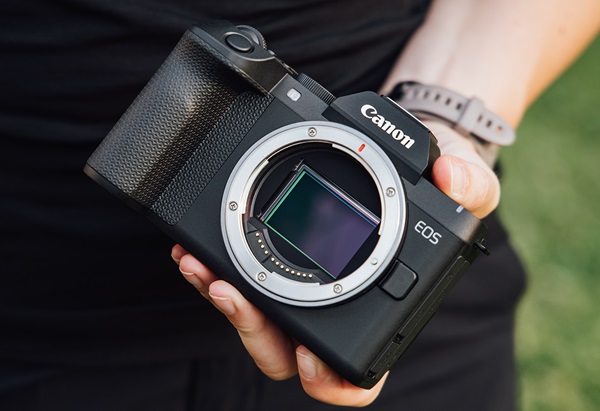 Canon mirrorless camera with the lens removed, showing the large full-frame sensor inside the camera body