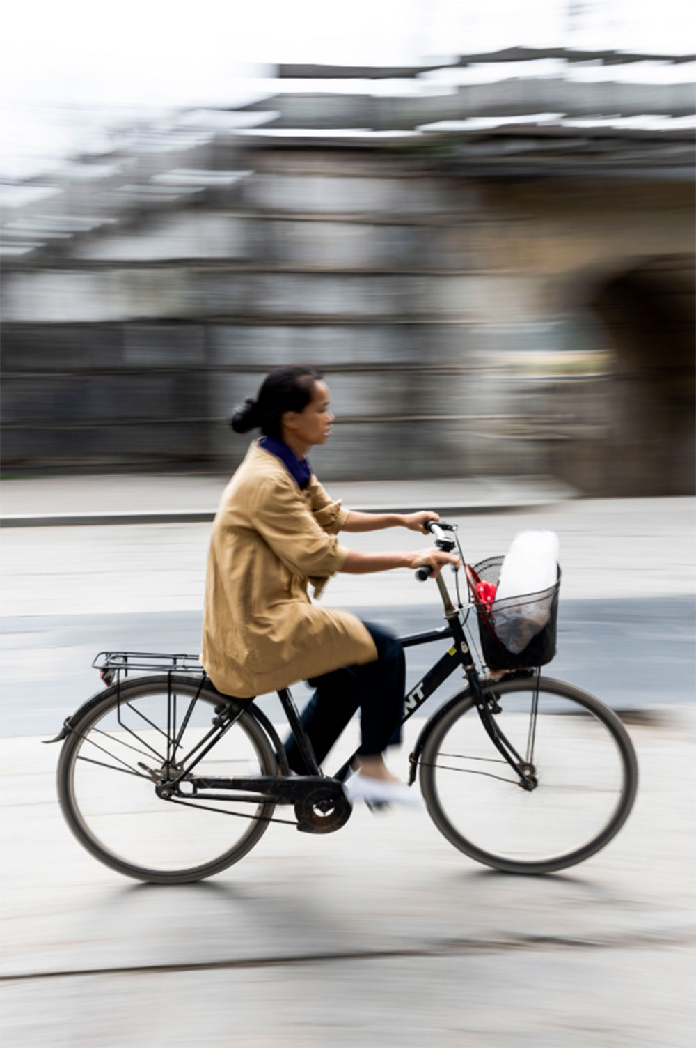 Girl on a moving bicycle