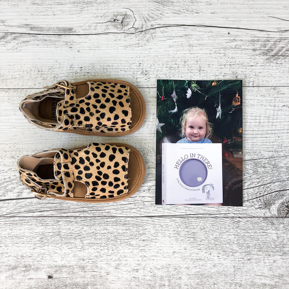 Children's pair of shoes and printed photo of child