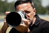 Canon Master Mark Horsburgh using a Canon EOS camera with telephoto lens