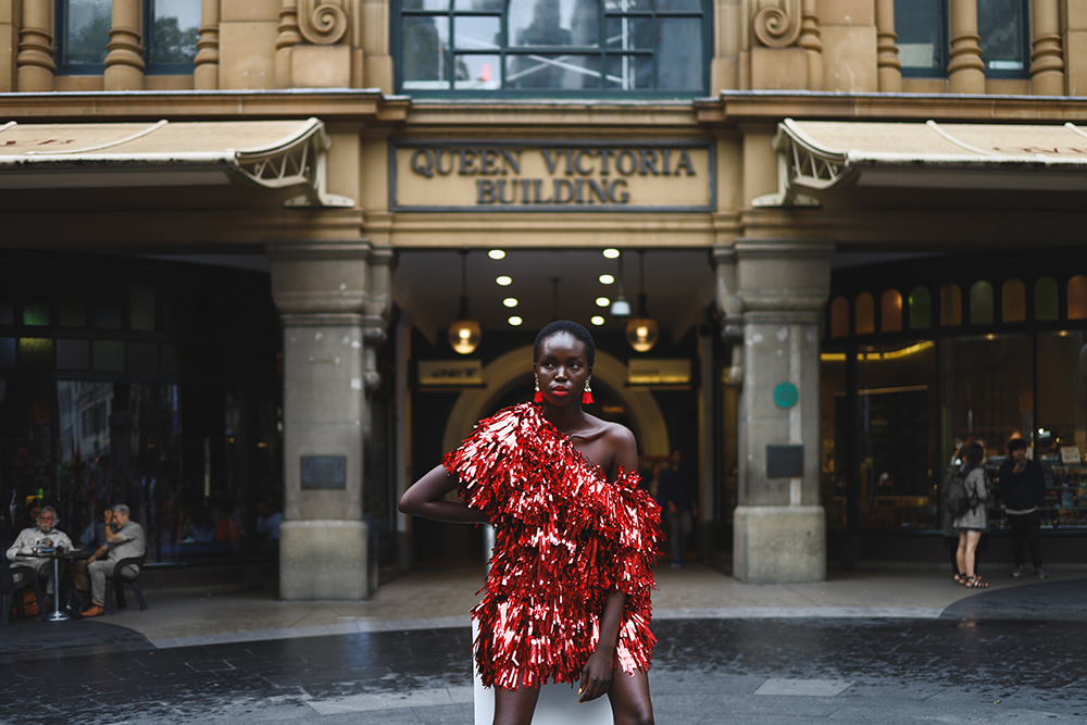 Model posing in front of Queen Victoria Building