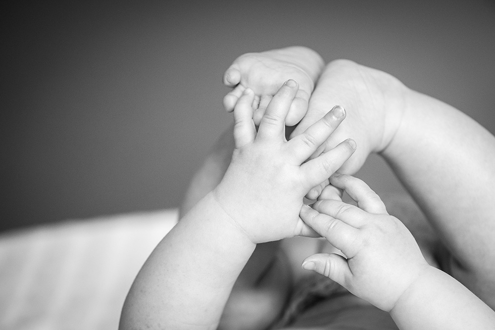 black and white image of baby's feet