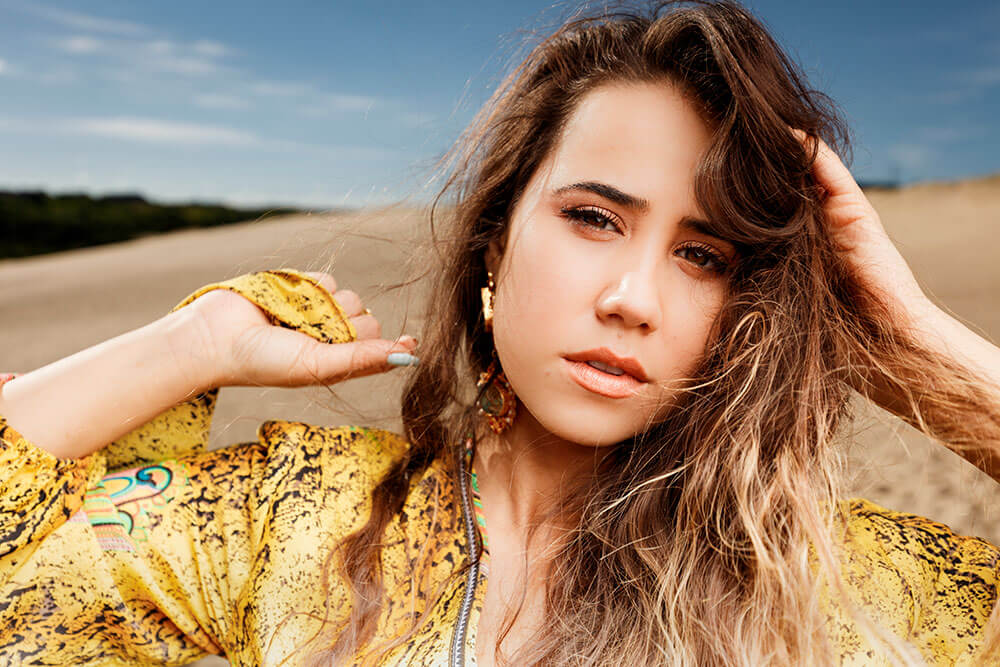 Portrait photo of model in yellow by Scott Stramyk