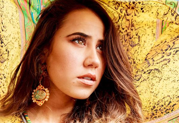 Closeup portrait photo of model in yellow by Scott Stramyk