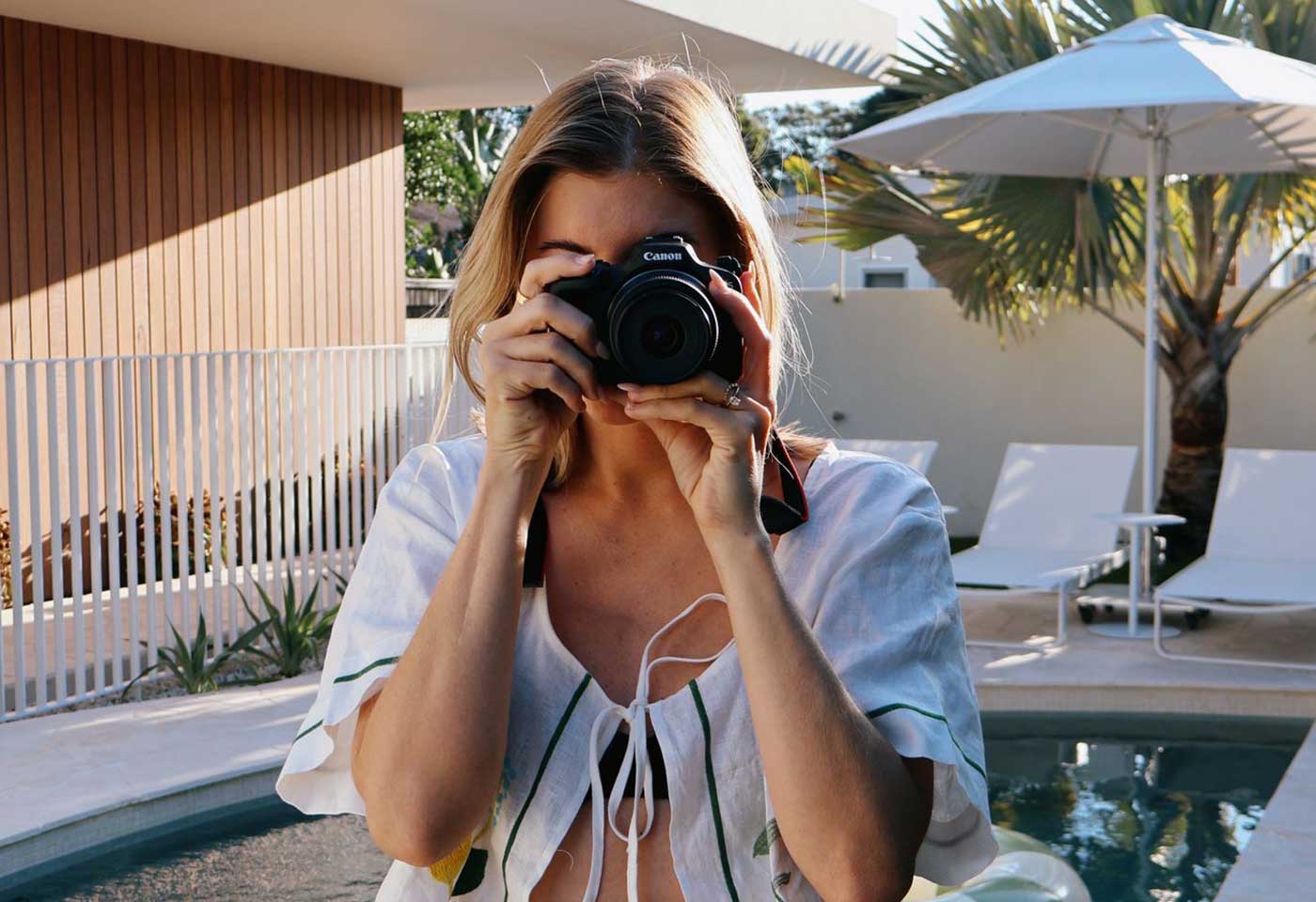 Ellie Watson with a Canon EOS camera