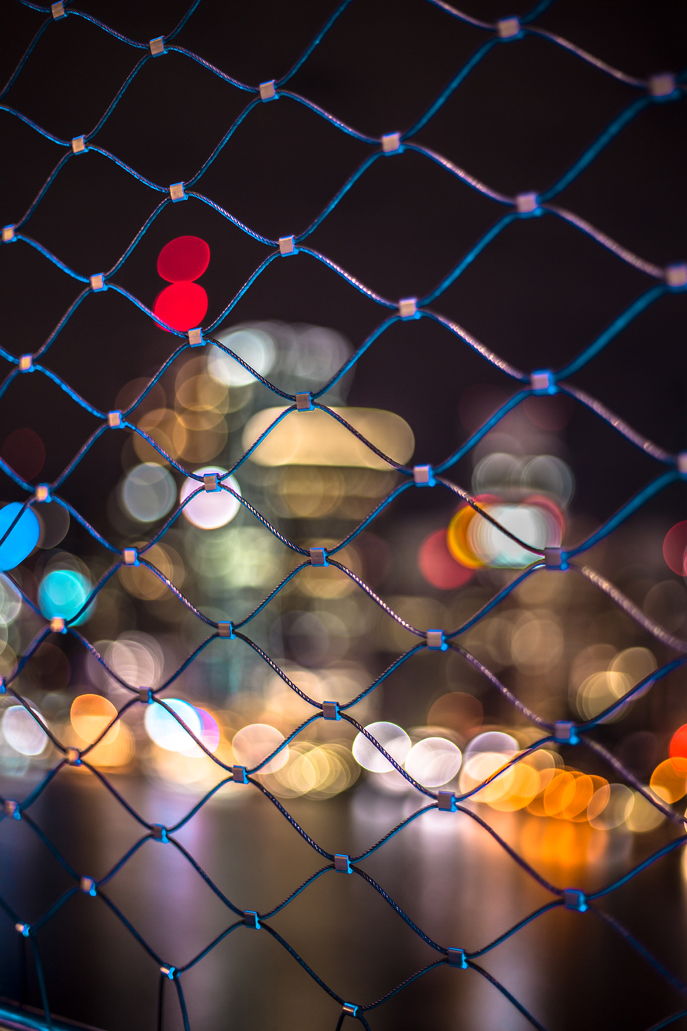 Lights through gate by Rachel