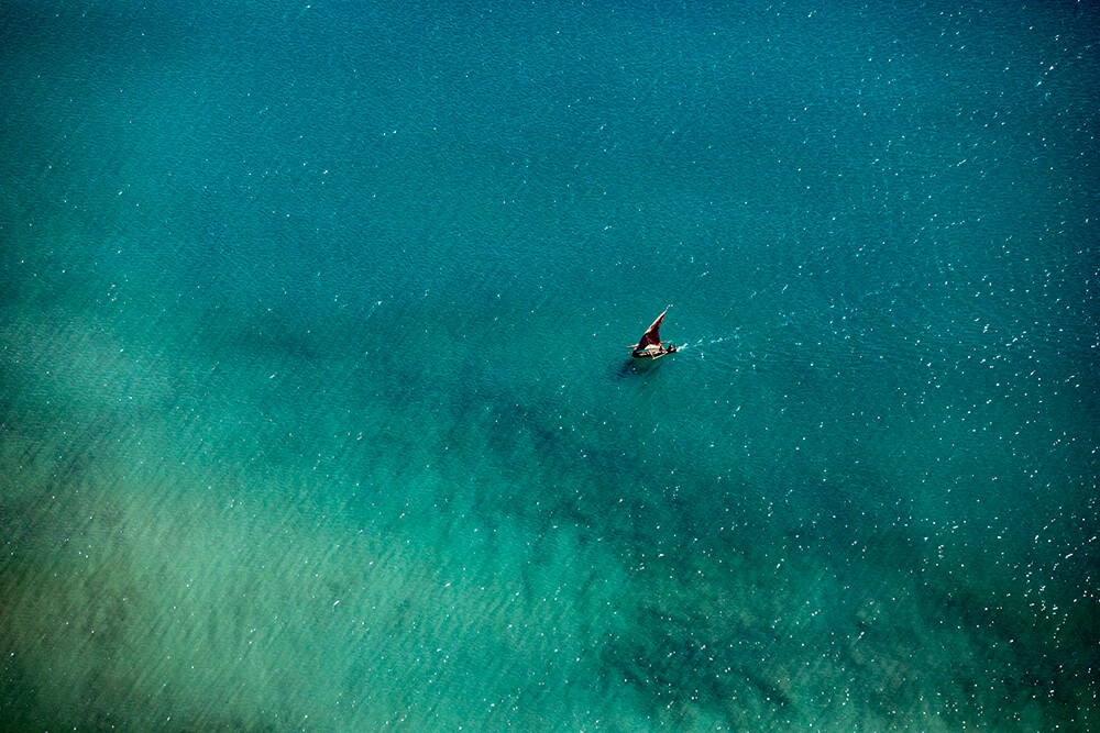 Aerial view of a boat during a flight to Madagascar. Shot by Jay Collier