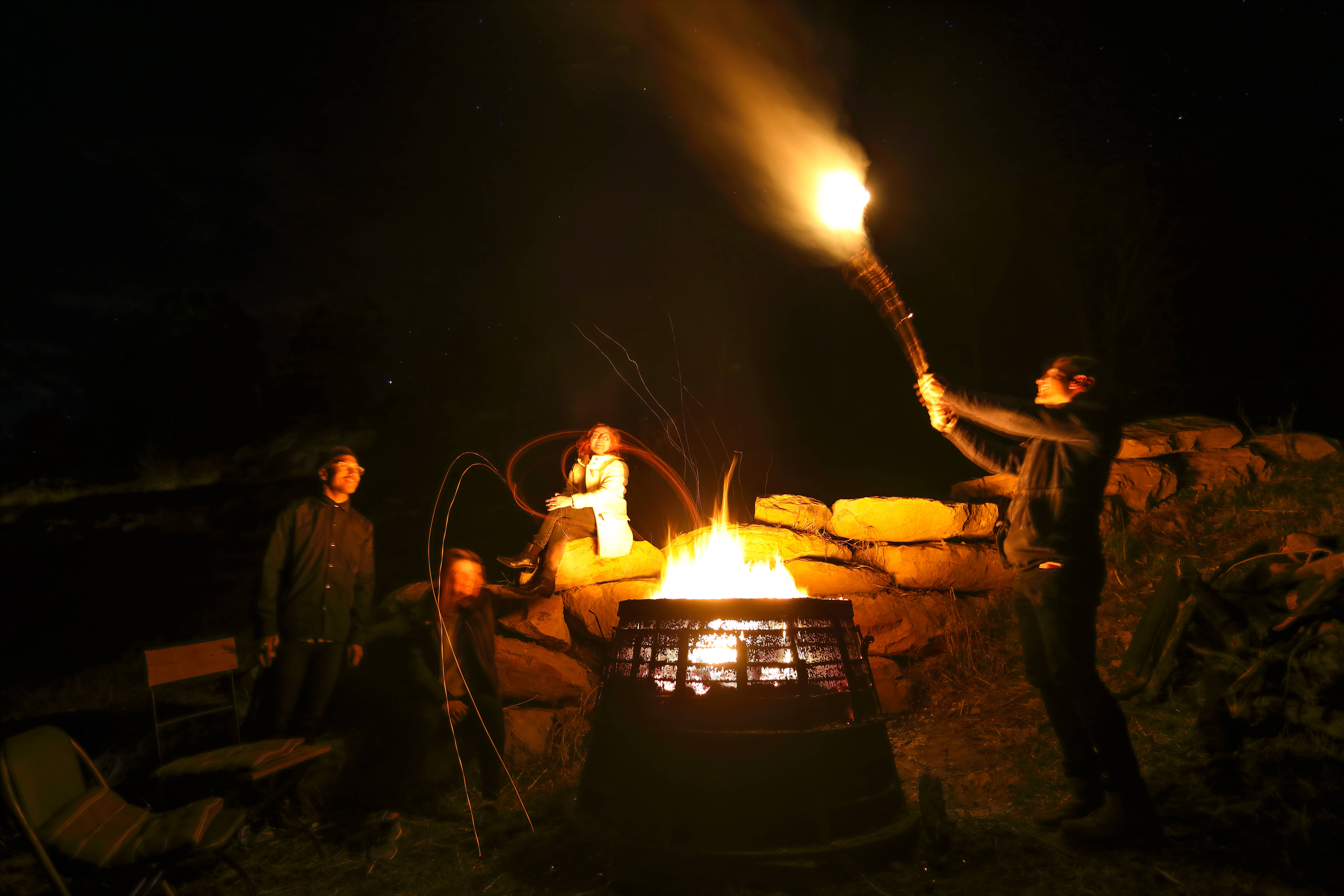 Image of friends around a campfire taken by Dr Chris Brown