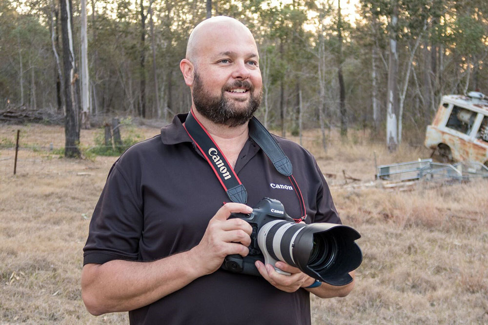 portrait image of greg photographing