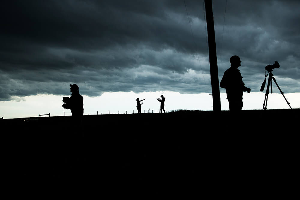 Photographers shooting a tornado
