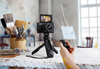 Canon PowerShot G7X Mark III on a tripod with remote controller