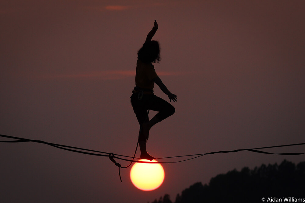 Image of slackline in sunset