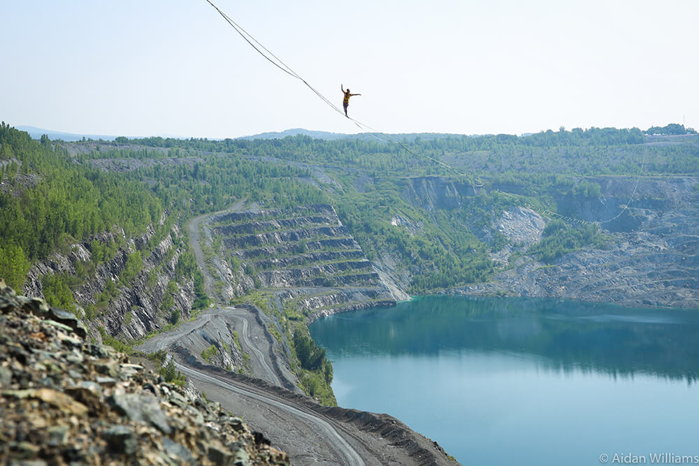 Image of Slacklining above a lake by Aidan Williams