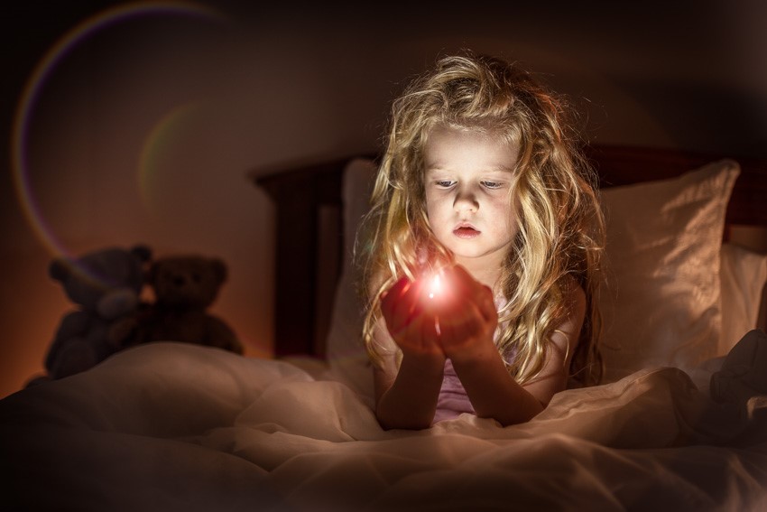 child playing with light