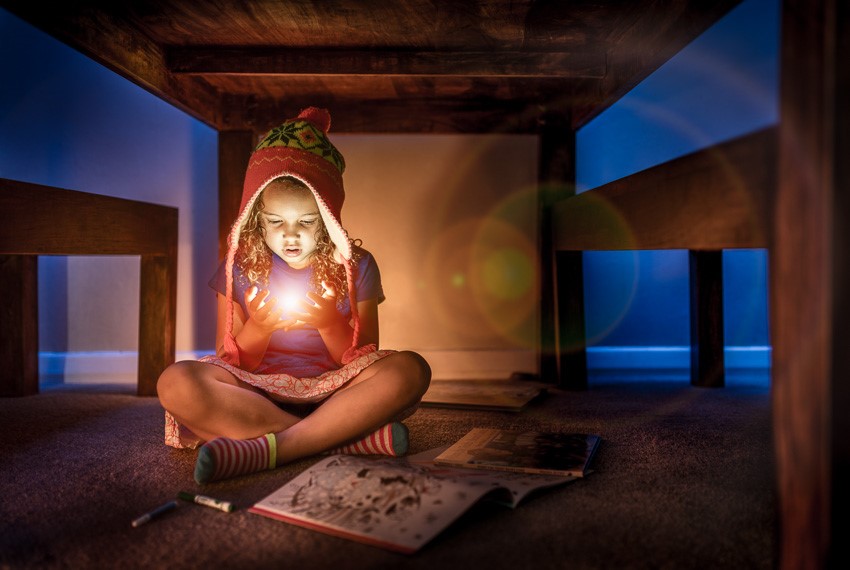 child playing with light