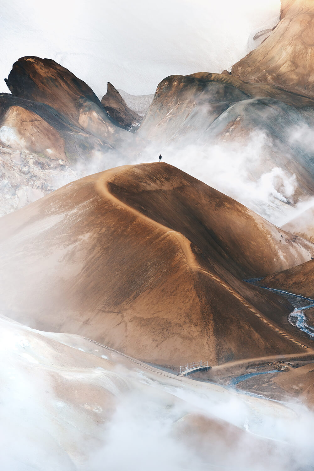 Landscape image of clouds ontop of mountain