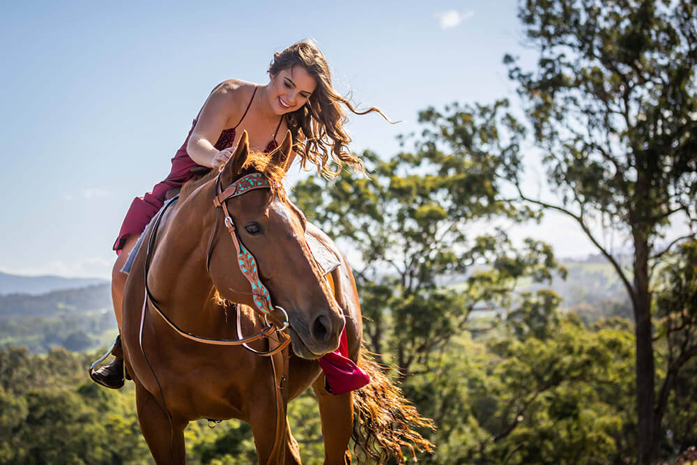 Photo of woman riding a horse by Judith Conning