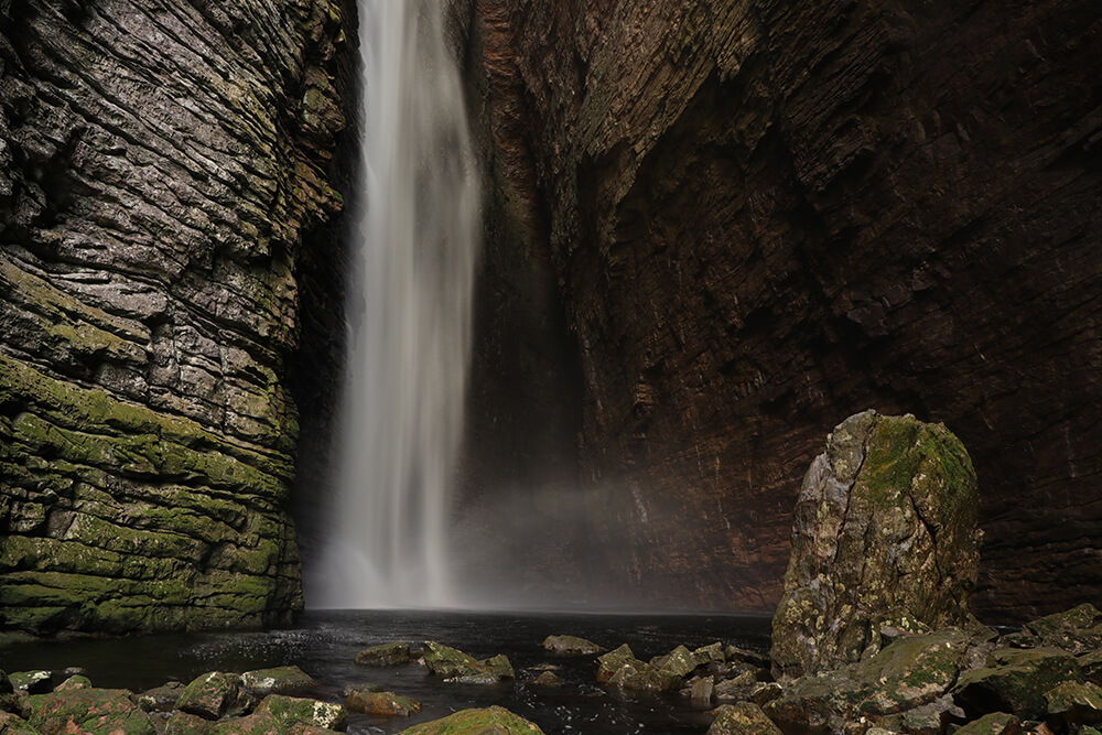 Waterfalls inside a cave by Emily Schacher 