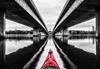 image of red kayak tip between two bridges