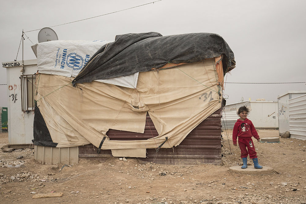 Lsnadscape image of kid in refugee camp
