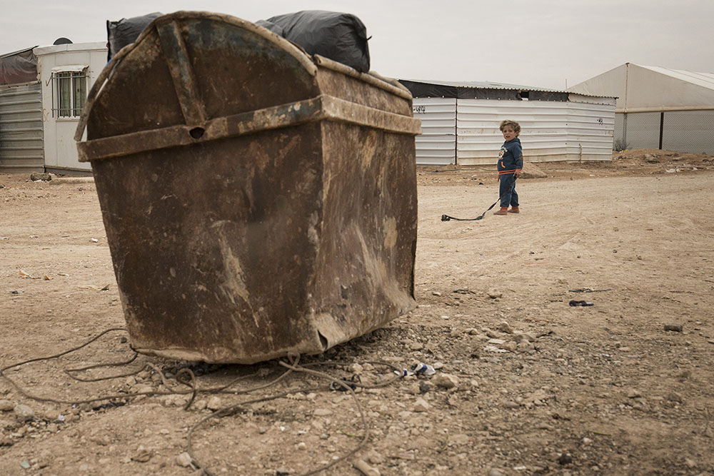 Lsnadscape image of kid in refugee camp