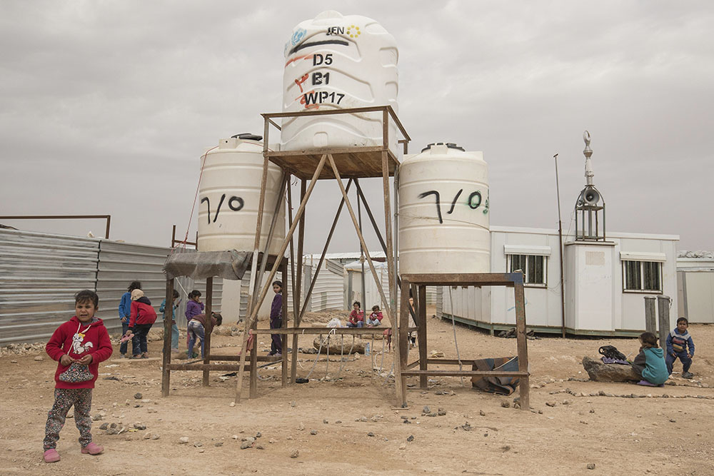 Lsnadscape image of kid in refugee camp