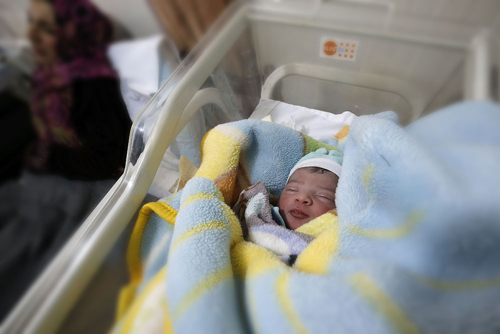 image of baby born in refugee camp