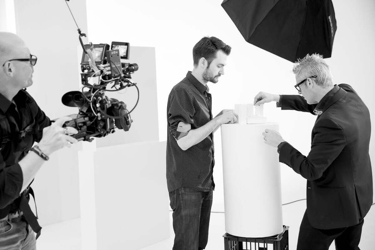 Black and white photo of Daniel Linnet getting studio ready