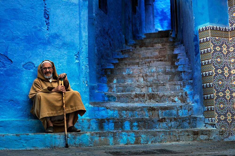 A Moroccan local next to a stair. Image by Brook Rushton