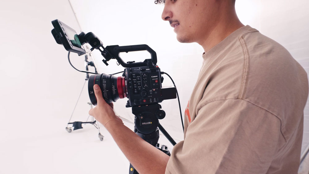 Man in a studio holding the Canon EOS C400 Content 1