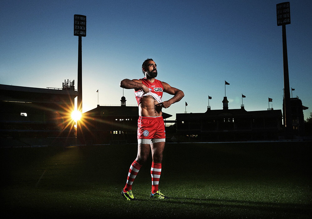Adam Goodes re-enacting Nicky Winmar’s famous stance against racism