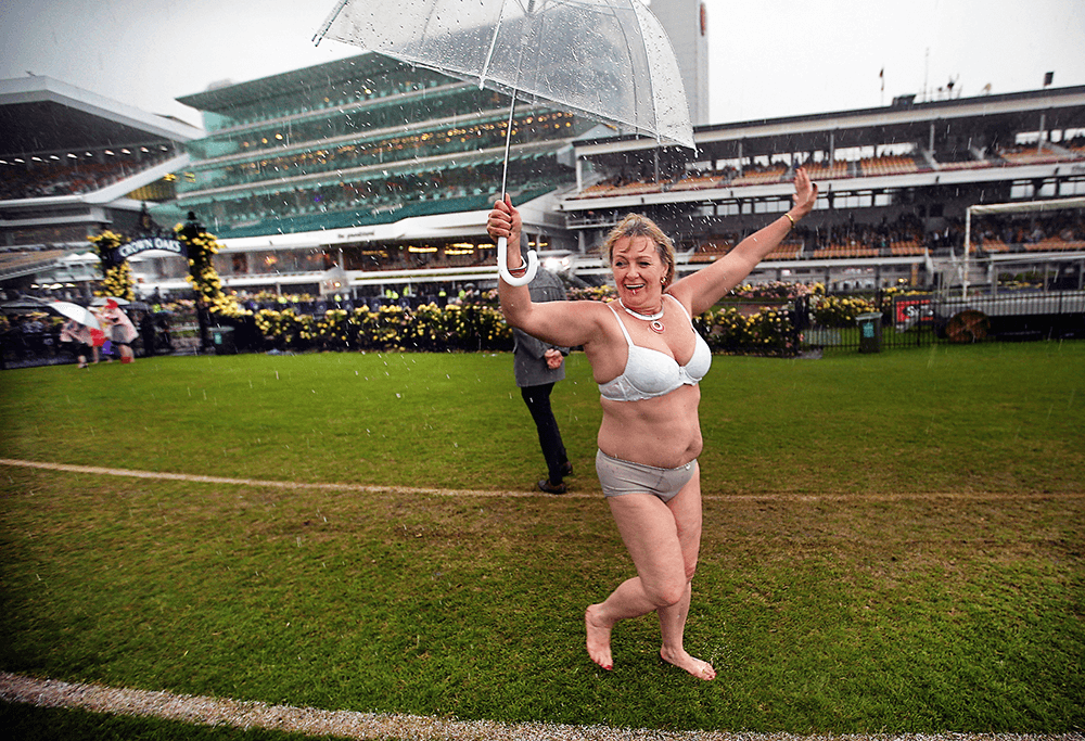 Flemington Oaks Day 2015. The heavens open up at as the crowd deals with the rain. Canon EOS-1D X, EF16-35mm f/2.8L II USM lens @ 17mm. 1/400s @ f2.8, ISO 1000.