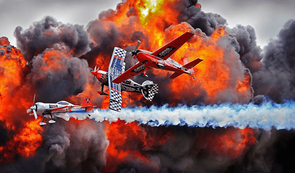 Avalon Air Show 2015. Here, Pilot Melissa Pemberton [in the red aircraft] flys as part of 'The immortals' during the Airshow. Canon EOS-1D X, EF70-200mm f/2.8L IS II USM +1.4x @ 260mm. 1/800s @ f5, ISO 250.